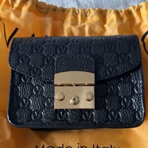 Valentino Black Crossbody Bag with Gold Accents.